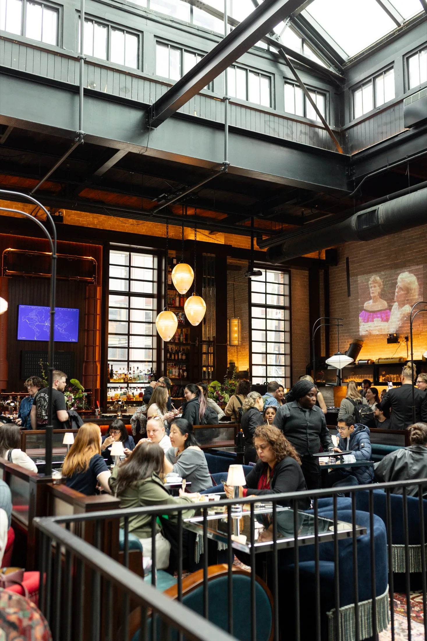 Guests gathered in a polished restaurant event room